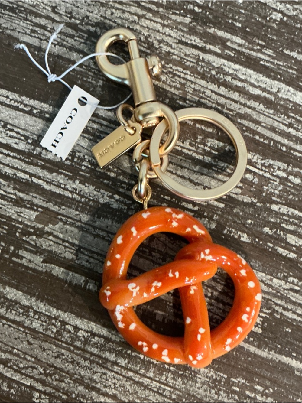 Coach Orange Pretzel Charm Keyring/Bag charm with Gold Hardware. Dusty Included